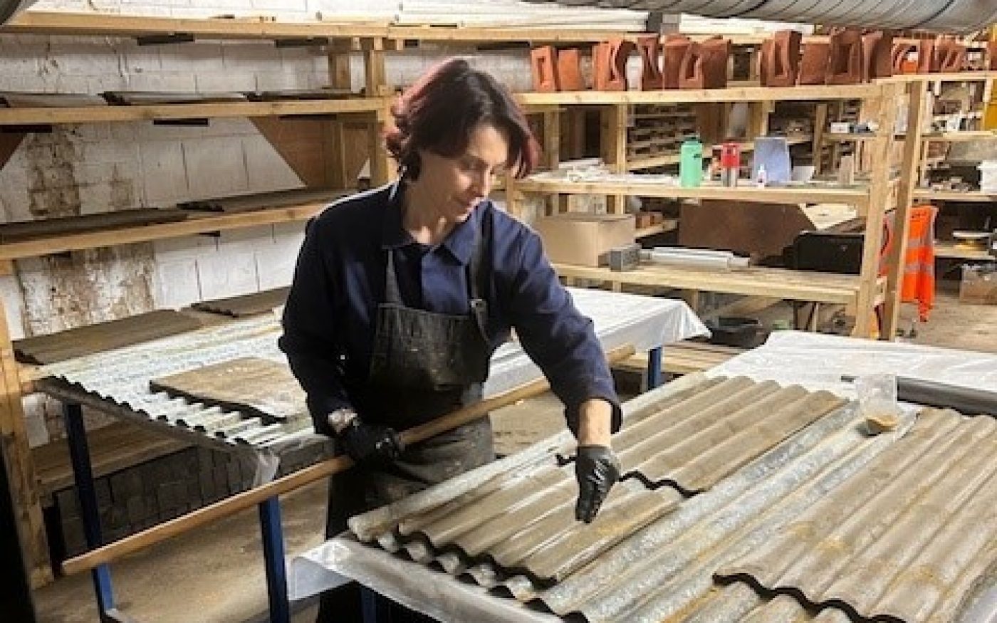 Picture of Livia working on her slow worm shelter