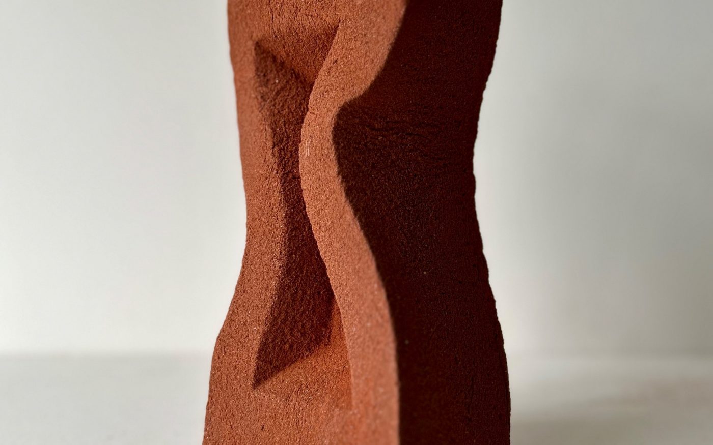 Curvy misshaped clay brick sculpture