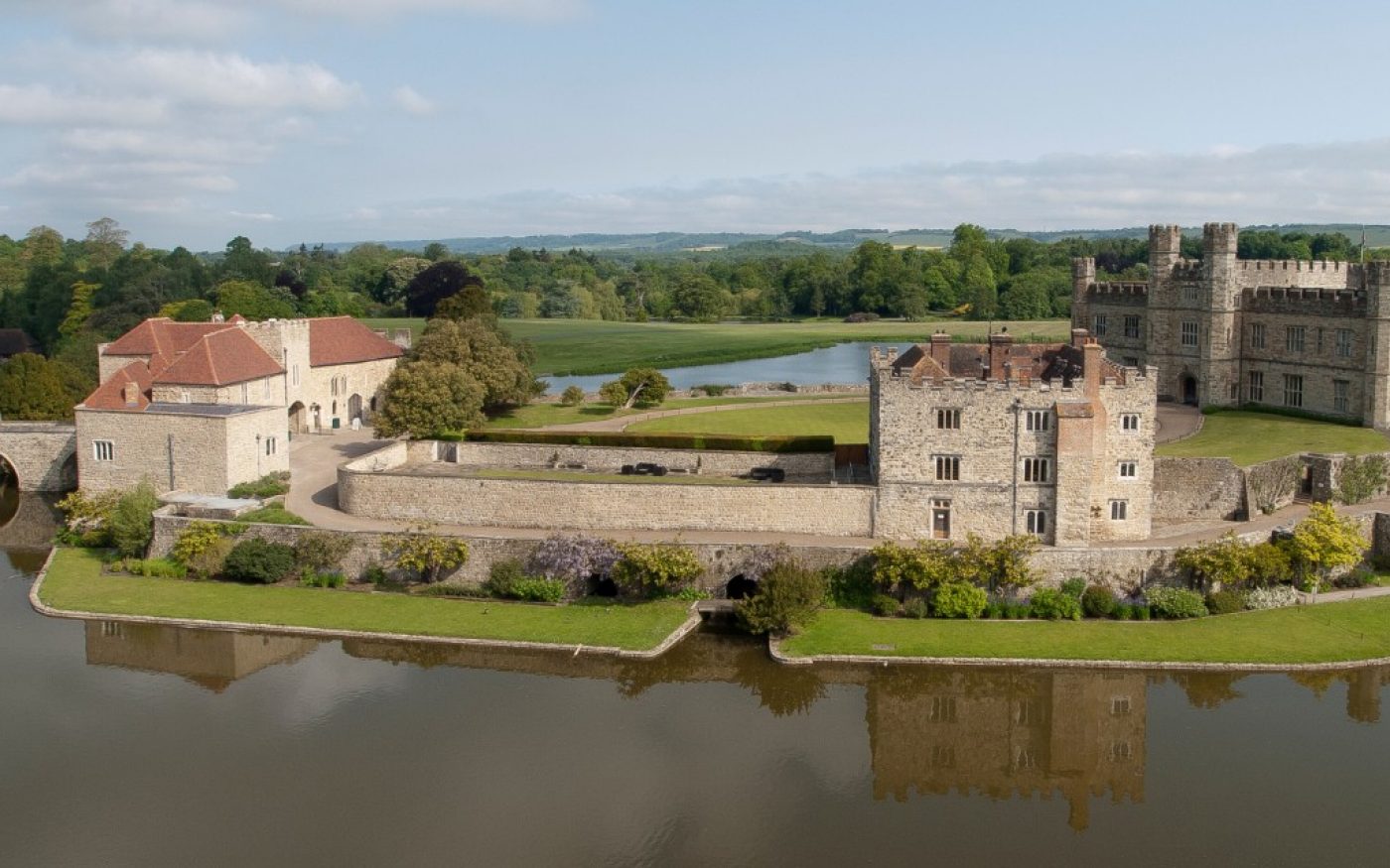 View of Leeds Castle across the moat with newly renovated Gatehouse roof