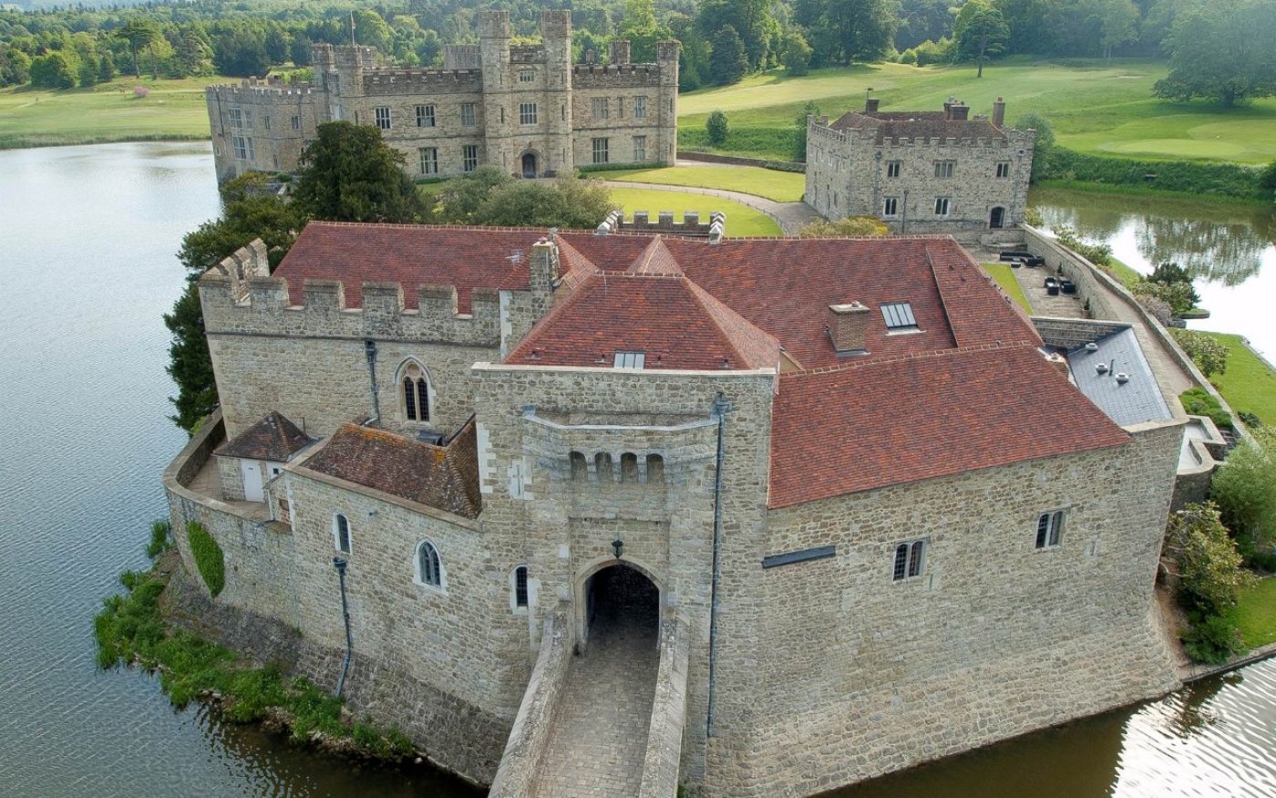 Aerial view of Leeds Castle and gatehouse with renovated handmade tile roof