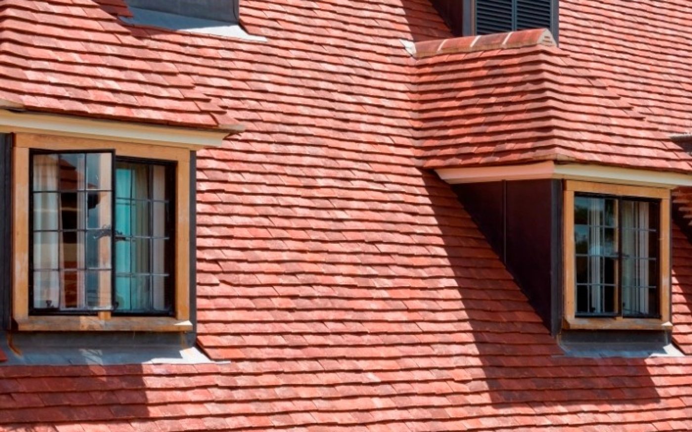 Dormer windows on newly refurbished roof using handmade clay roof tiles