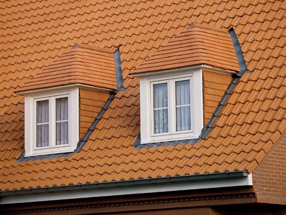 Roof gable againt cloudy sky