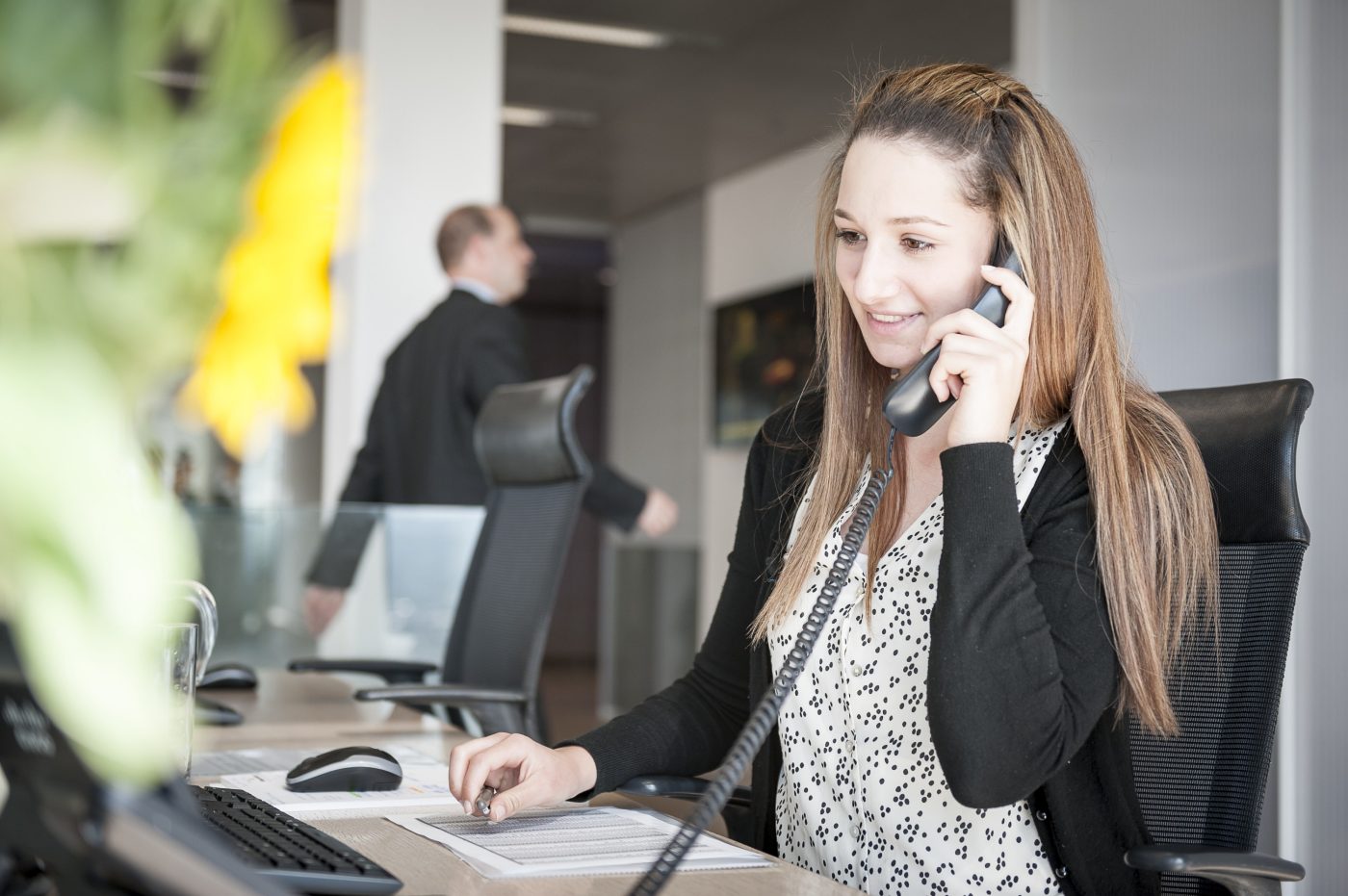 Young woman holding a telephone
