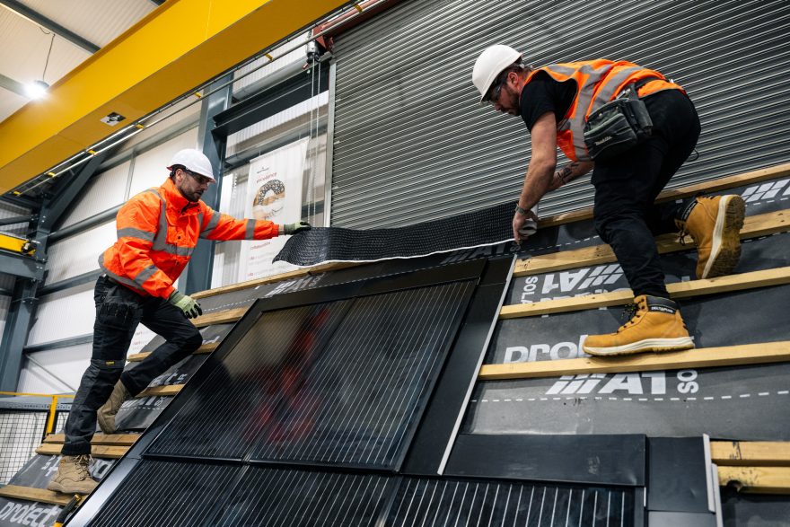 2 men demonstrating in roof solar installation