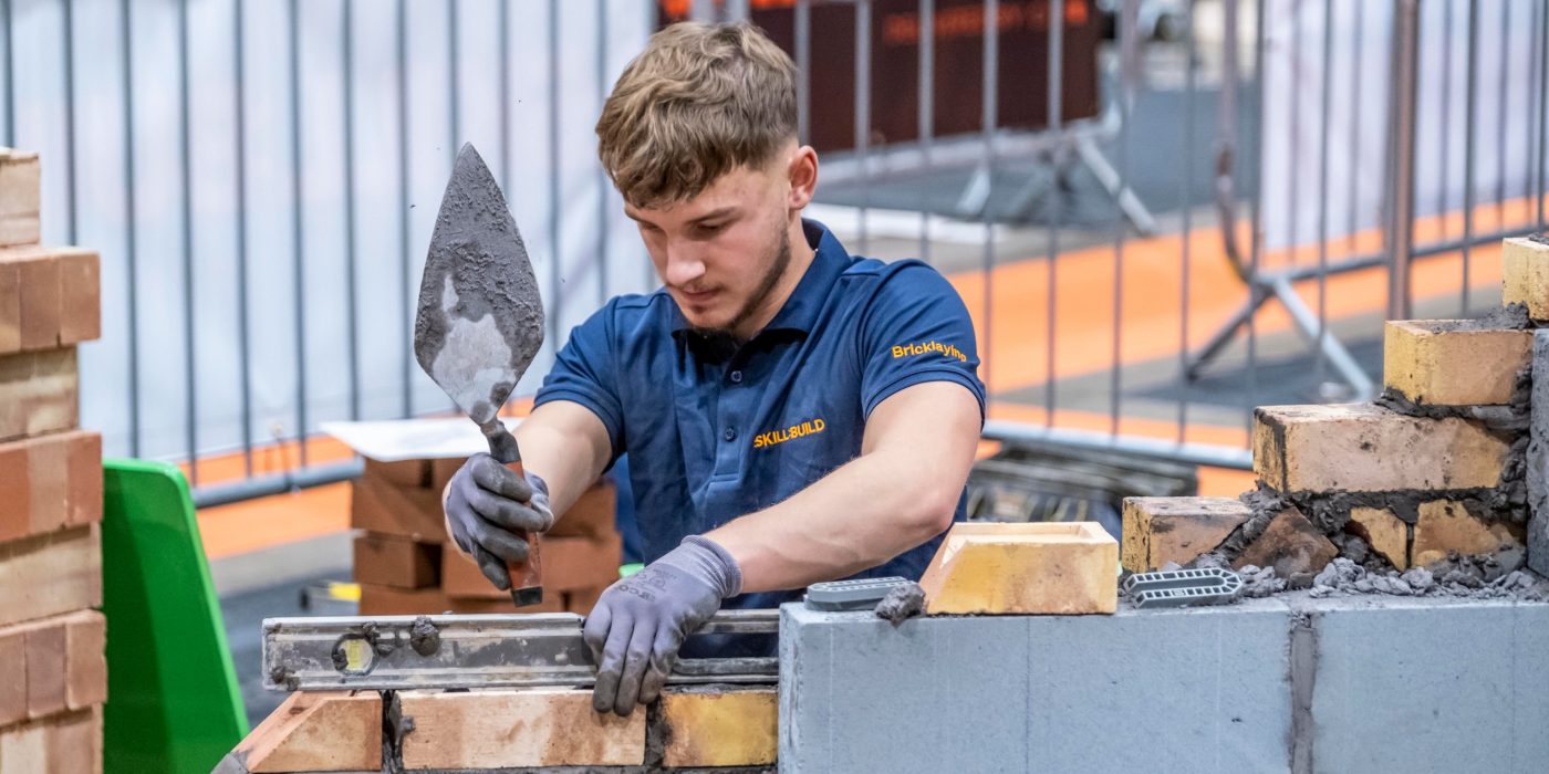 apprentice building a wall during Skillbuild 2023 competition