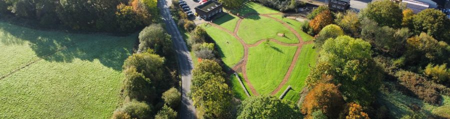 Birds eye view of paths through the grass at Ewhurst Factory