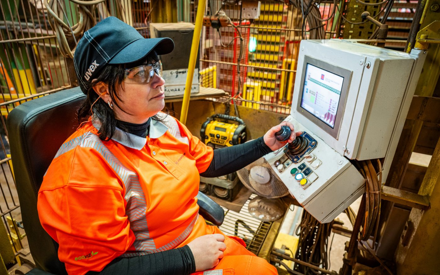 Image of a woman in construction operating machinery