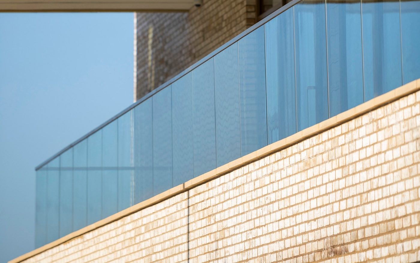 Modern brick building with glass balcony