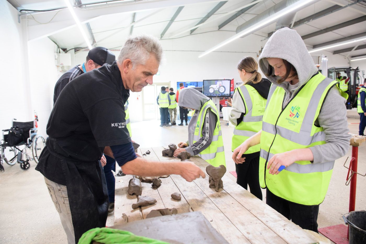 Group creating clay sculptures