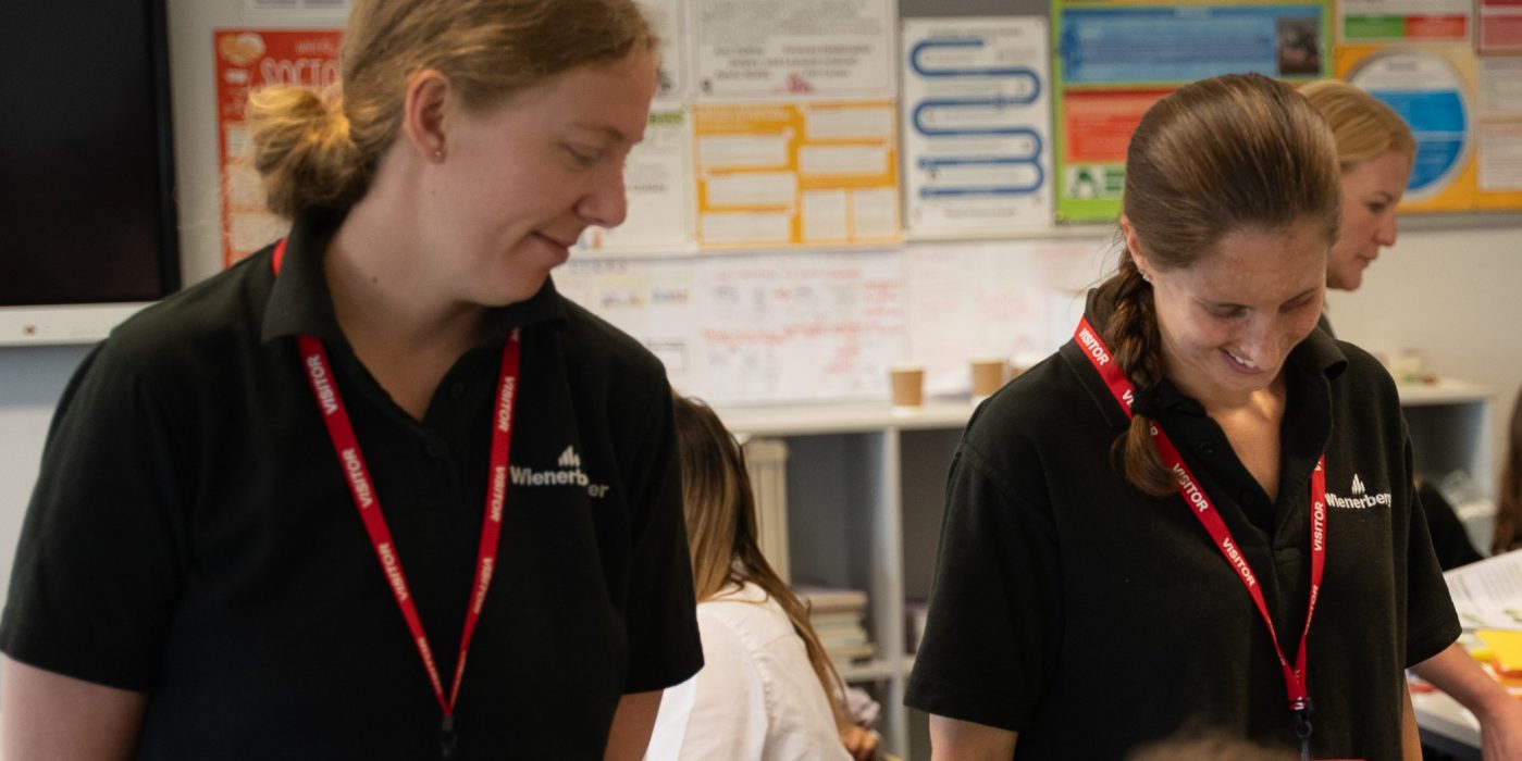 Two women from wienerberger presenting in a class room