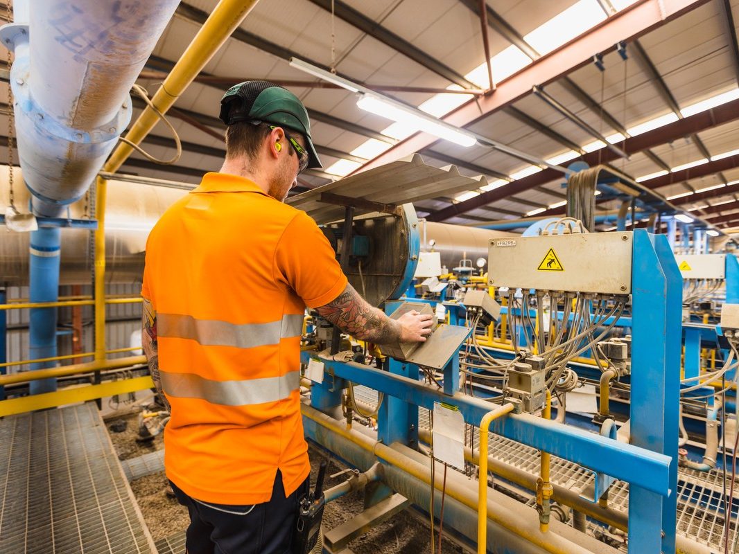 Man looking at brick products in factory