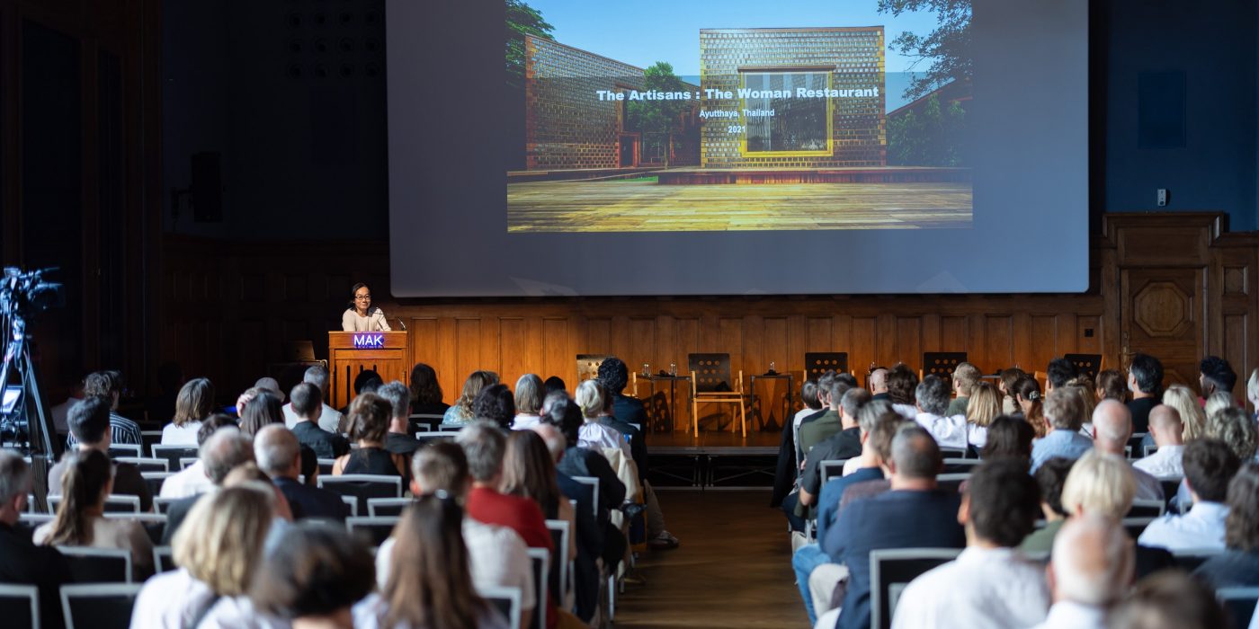 Audience watching a speech with presentation