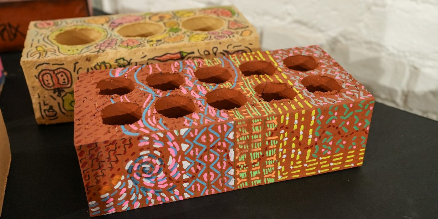 Colourfully decorated red bricks