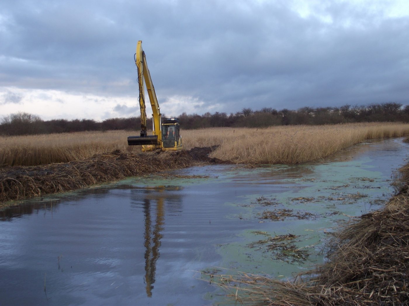 Digger at Broomfleet Factory restoring quarry lagoons