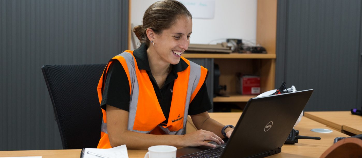 Wienerberger employee undertaking training, sat at desk