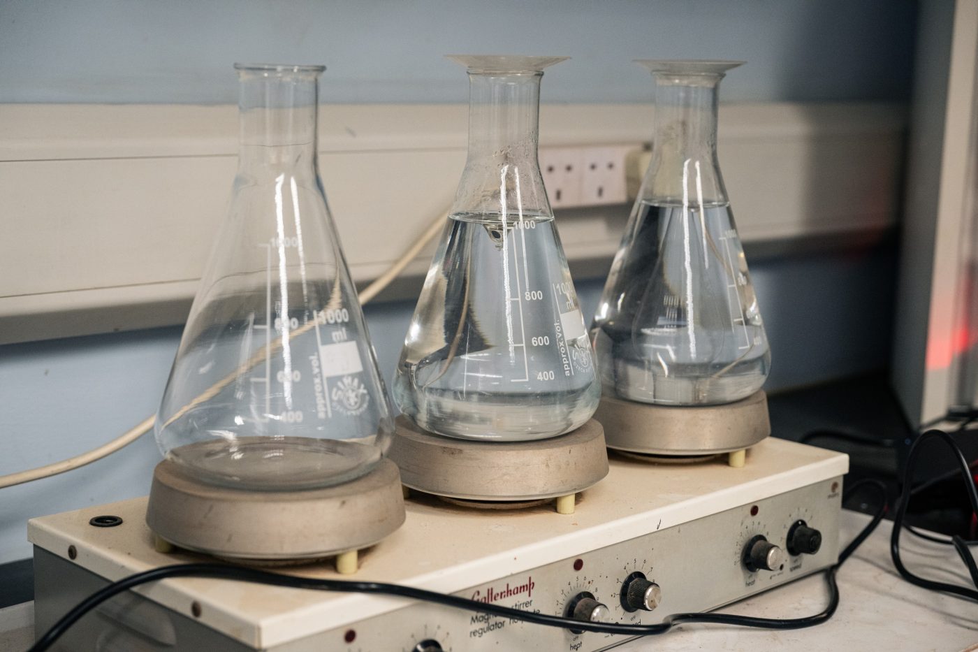 close up of three large laboratory test jars