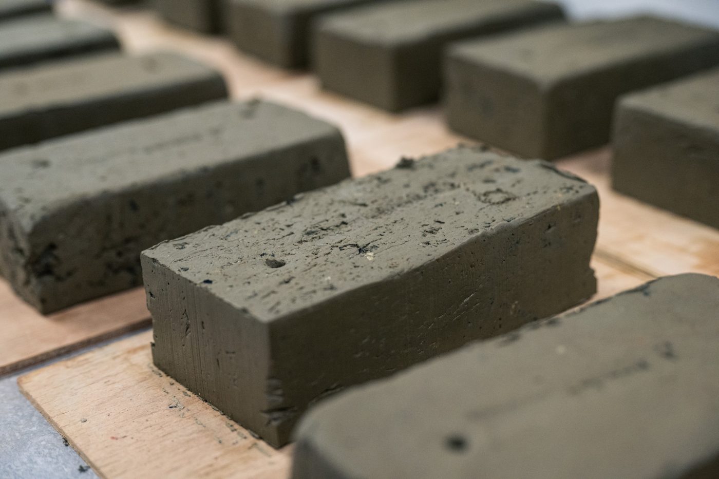 Close up of grey clay bricks that are not fired
