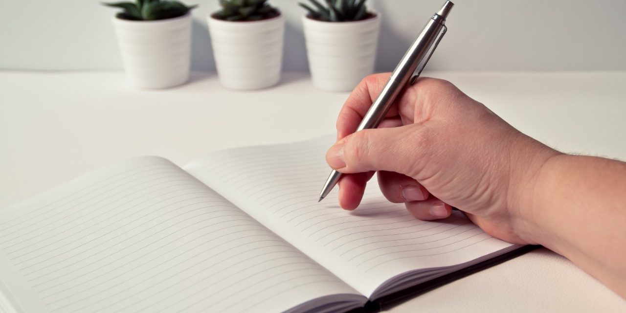 Writing in a notebook