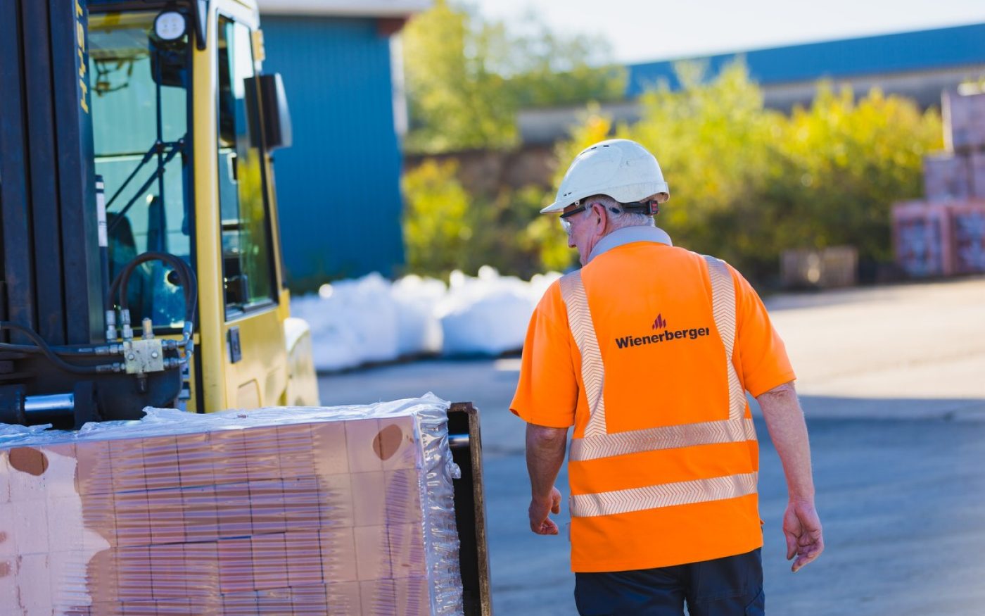 Man in Wienerberger jacket in stockyard