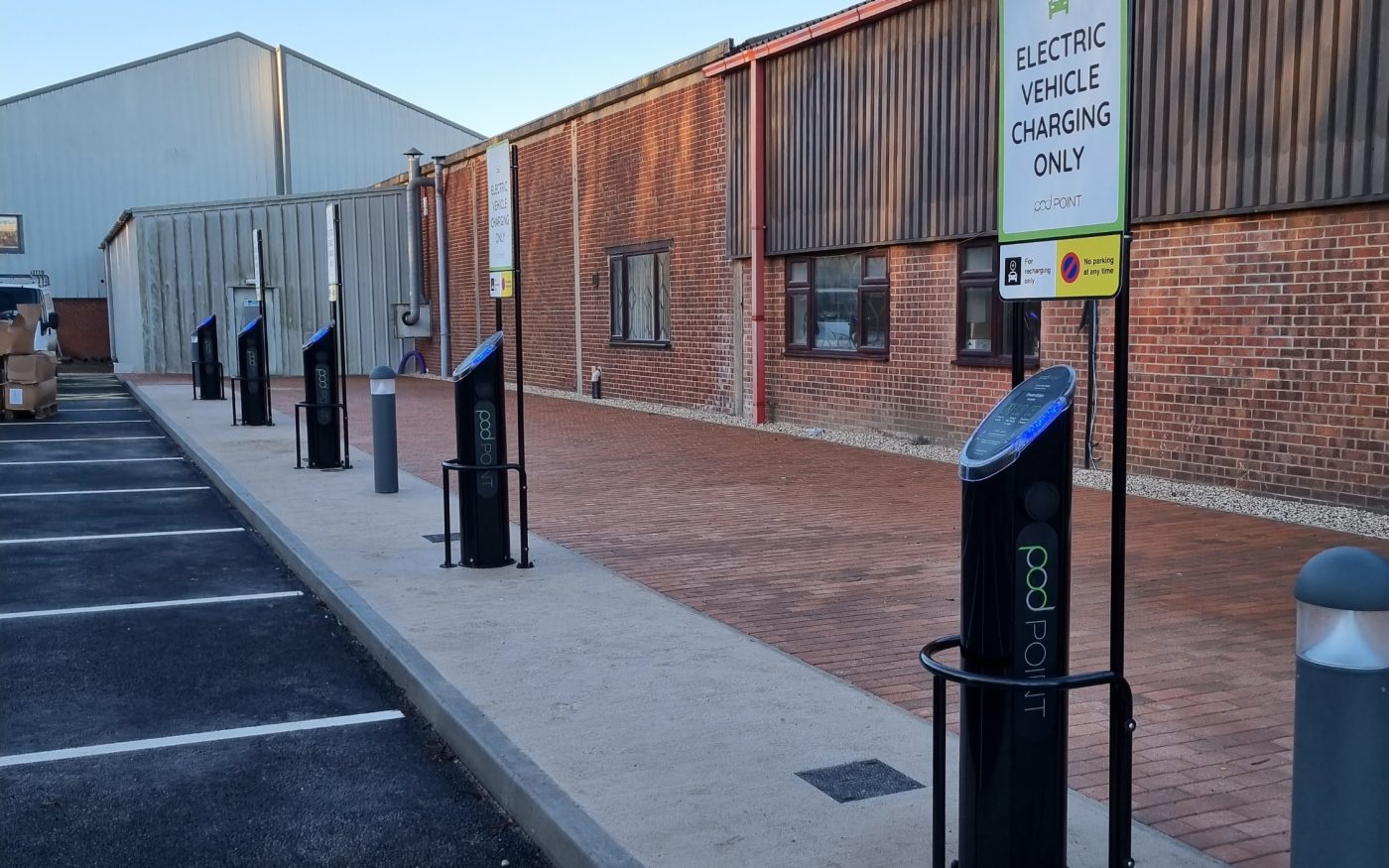 Man in forklift truck moving pallets of brick