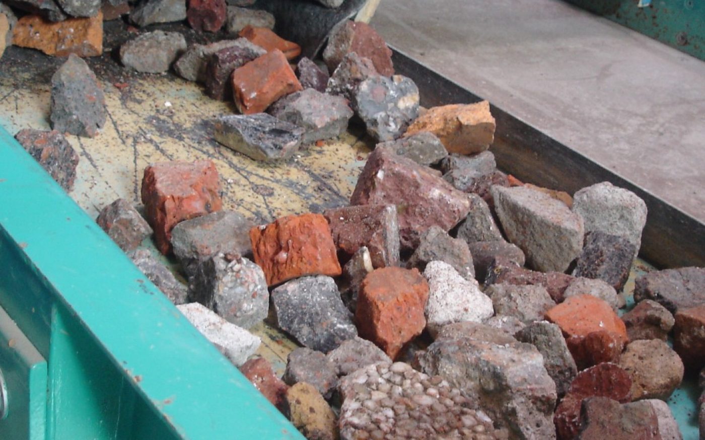 Man in forklift truck moving pallets of brick