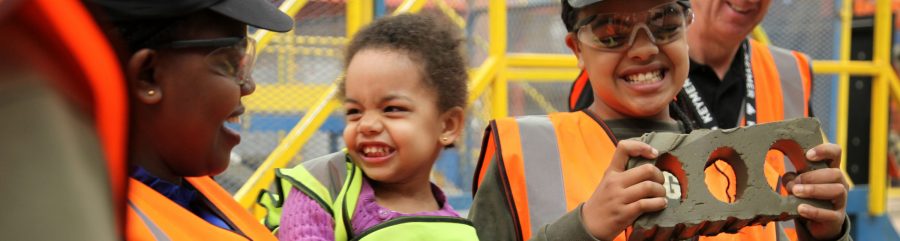 Young family attending a factory open day