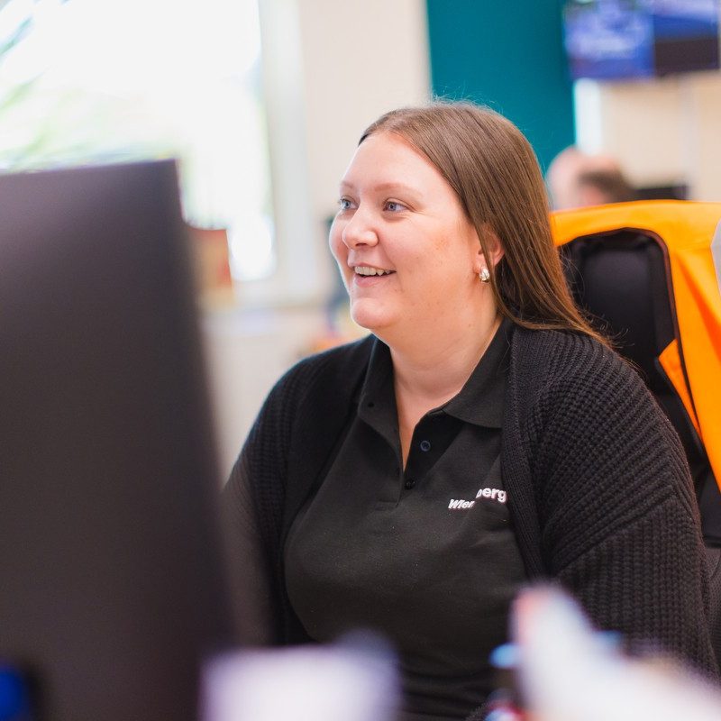 Smiling woman sat at desk