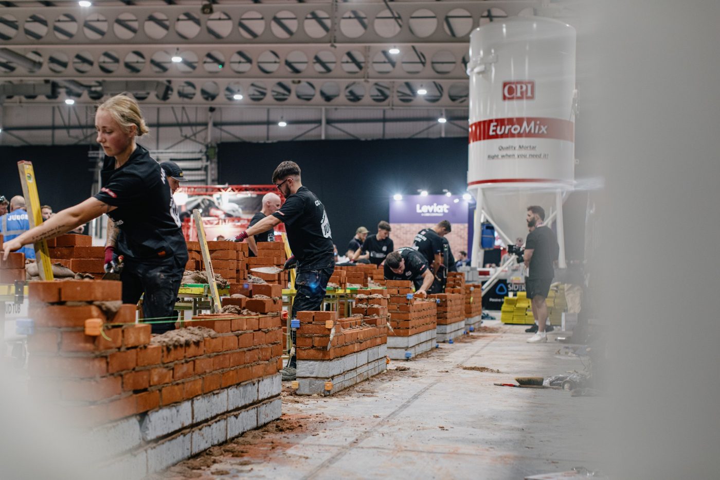 Competitiors building a brick wall during the SkillBuild competition