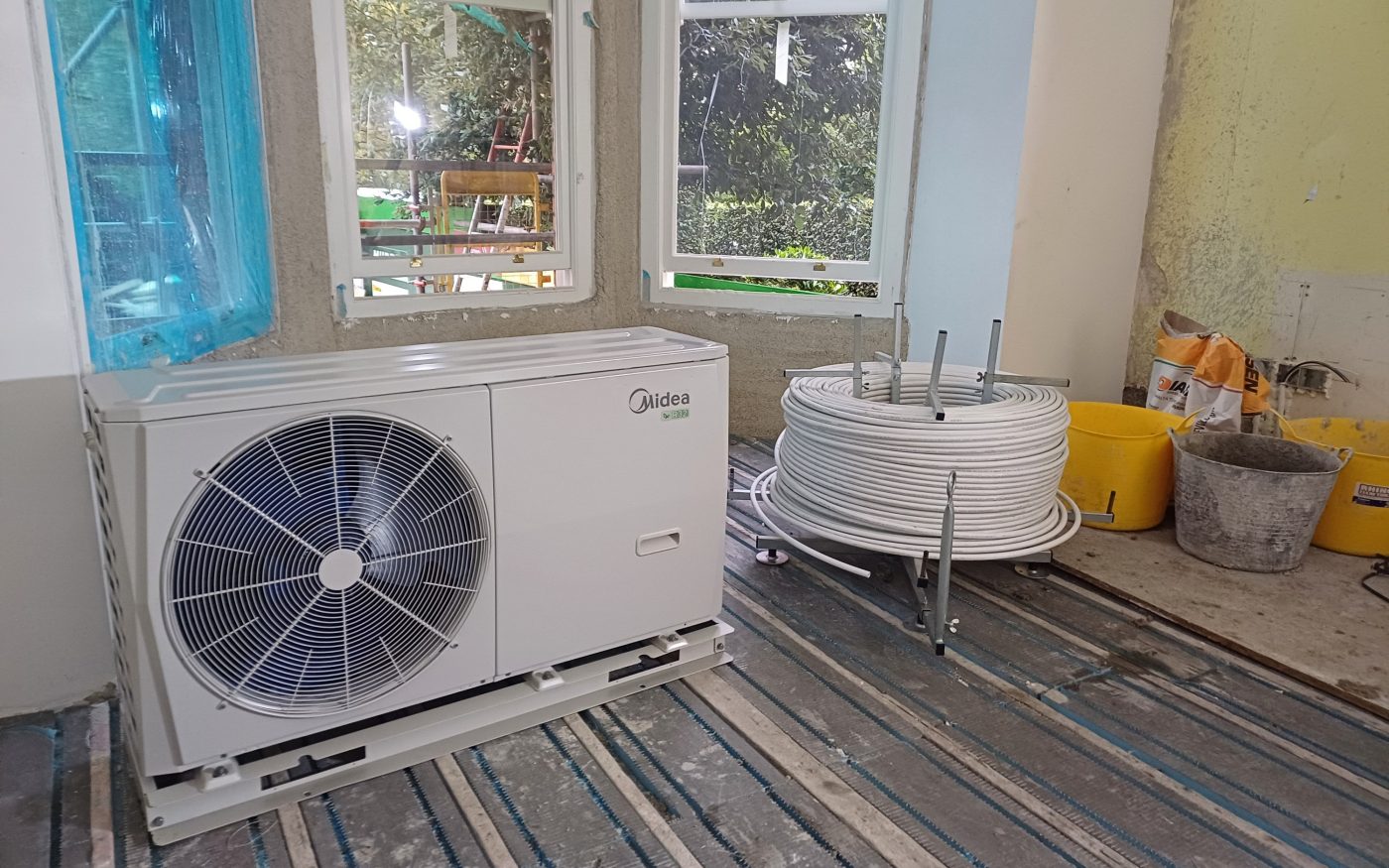 Image of underfloor heating being laid in a home