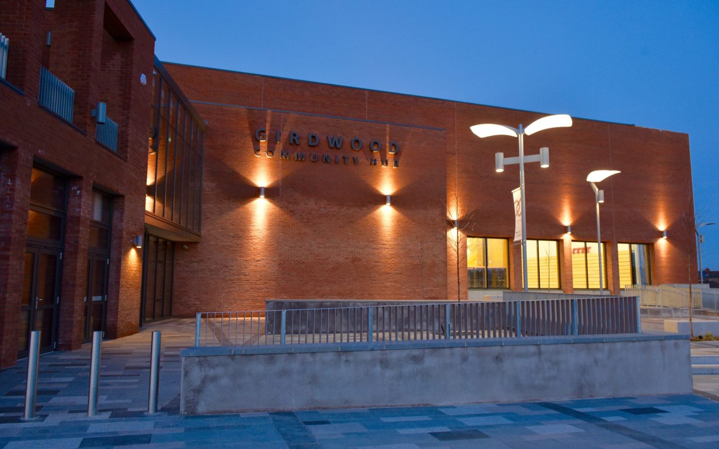 Girdwood Community Hub at dusk with the external nights on