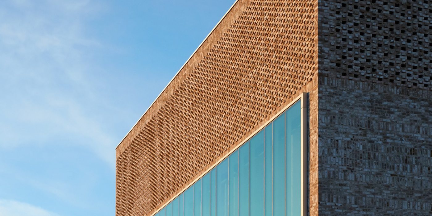 row of buff brick modern terraced houses