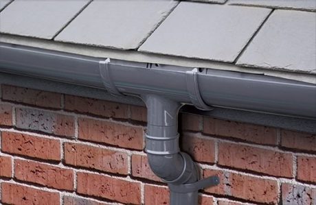 Grey guttering close up installed on a roof