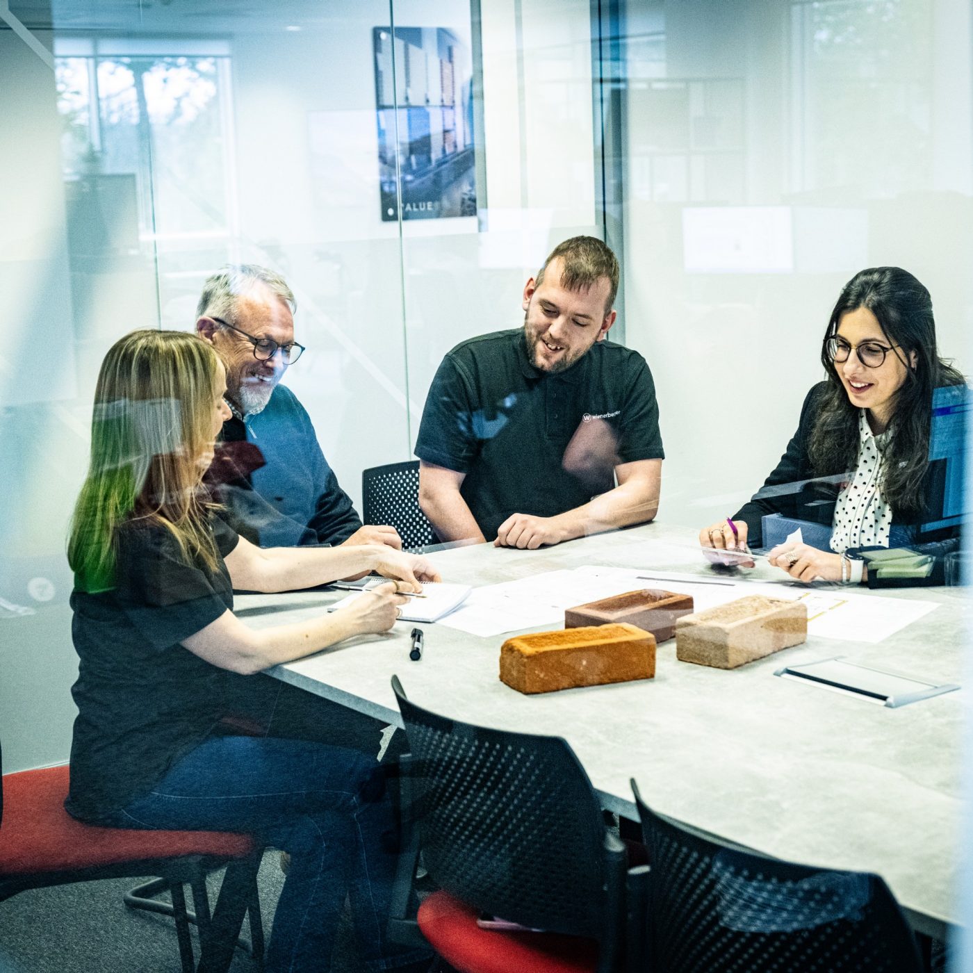 Technical team sat in a meeting room