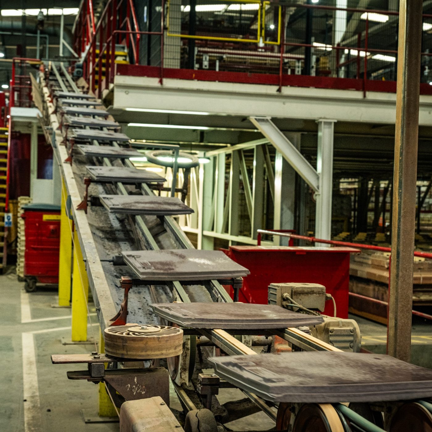 Roof tiles being manufactured in a factory