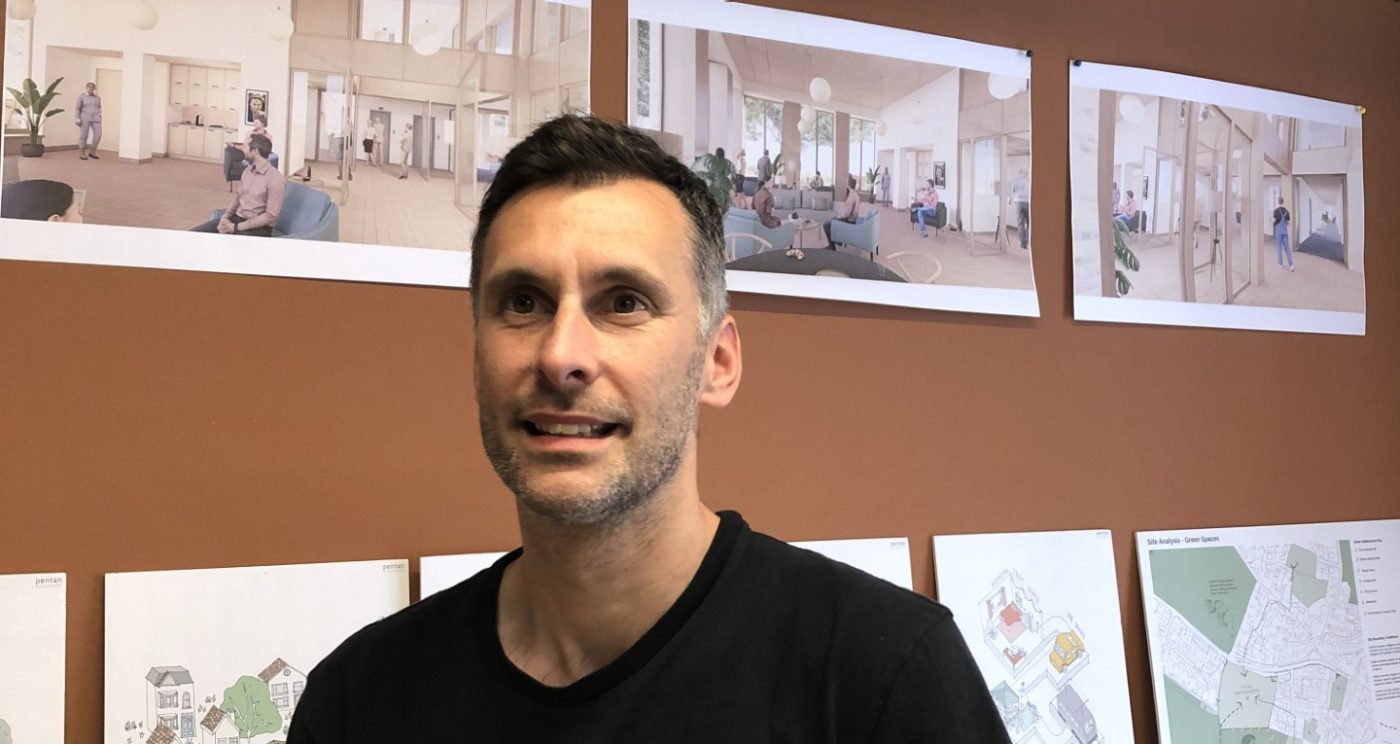 Image of Chris Wilkins looking away in conversation