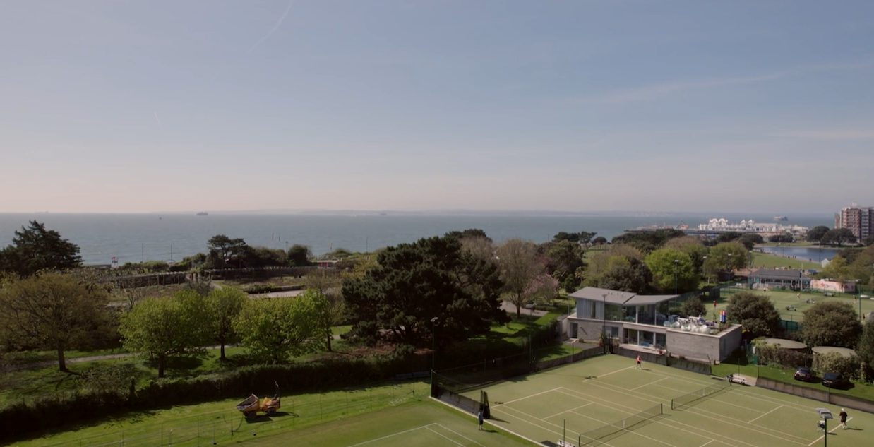 Birds eye view of PAD Studio project court x with tennis court and community centre