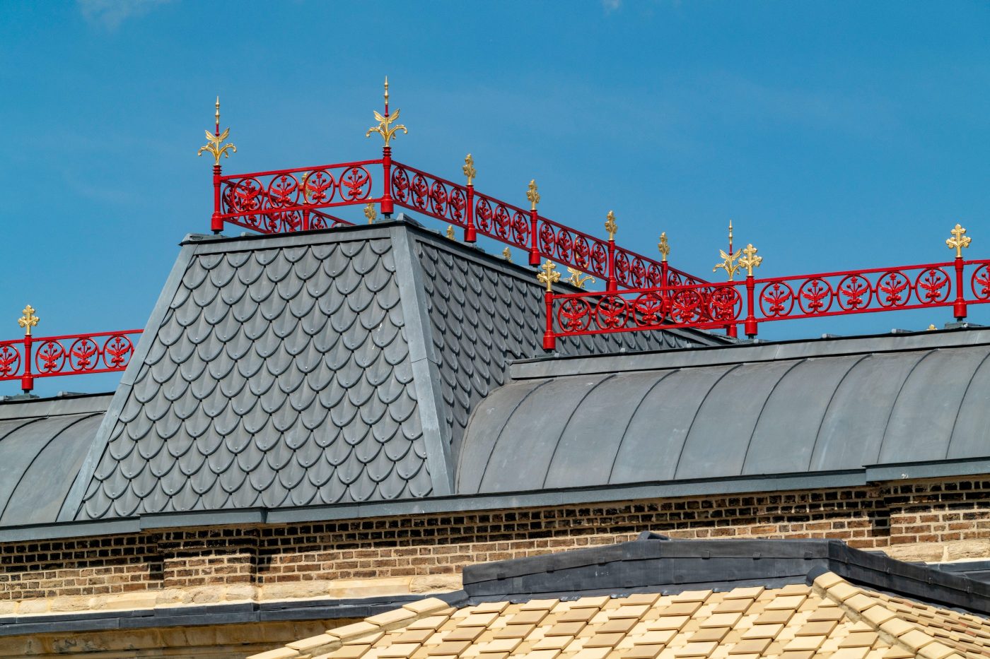 Traditional roof design with red fencing on Peckham Train Station