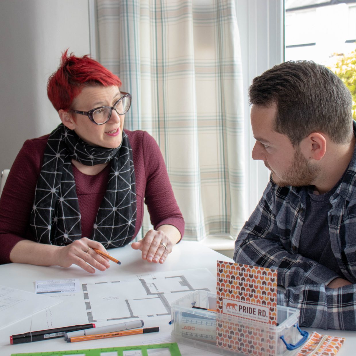 Architect Lisa Raynes consulting with a homeowner