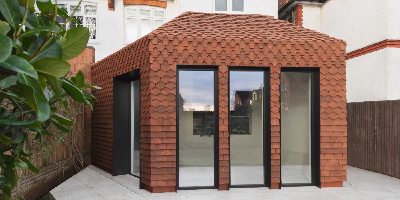 Modern extension using clay tiles as cladding