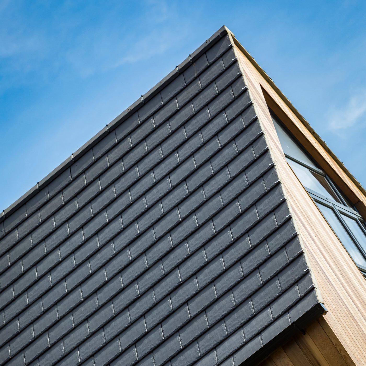 Caring Wood architectural design using heritage roof tiles