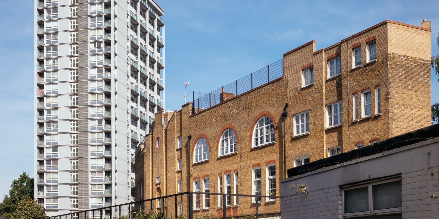 Circular door in modern brick building with circular window