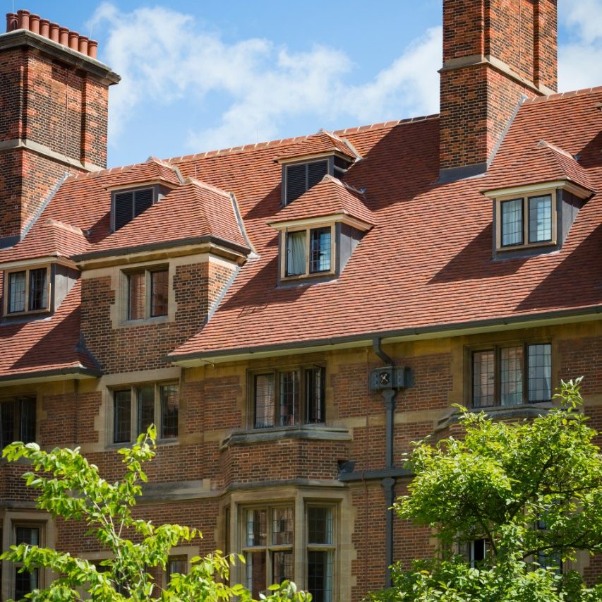 Dokett redbrick building with green lawn courtyard