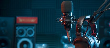 Podcast microphone with headphones hungover in a studio