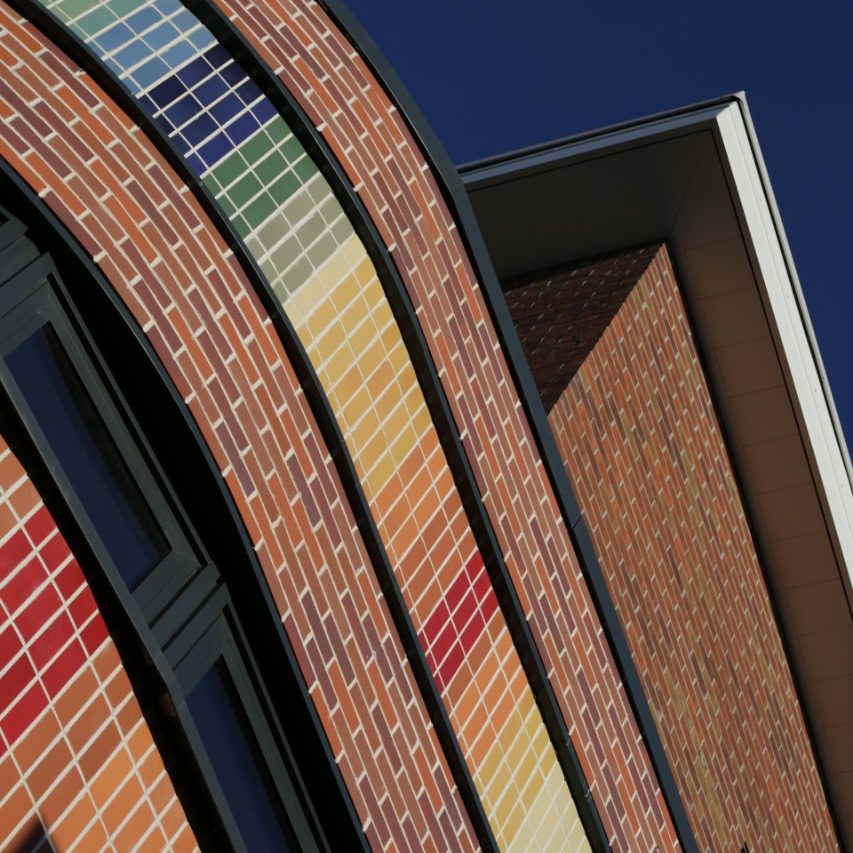 Rainbow facade on modern building using Corium