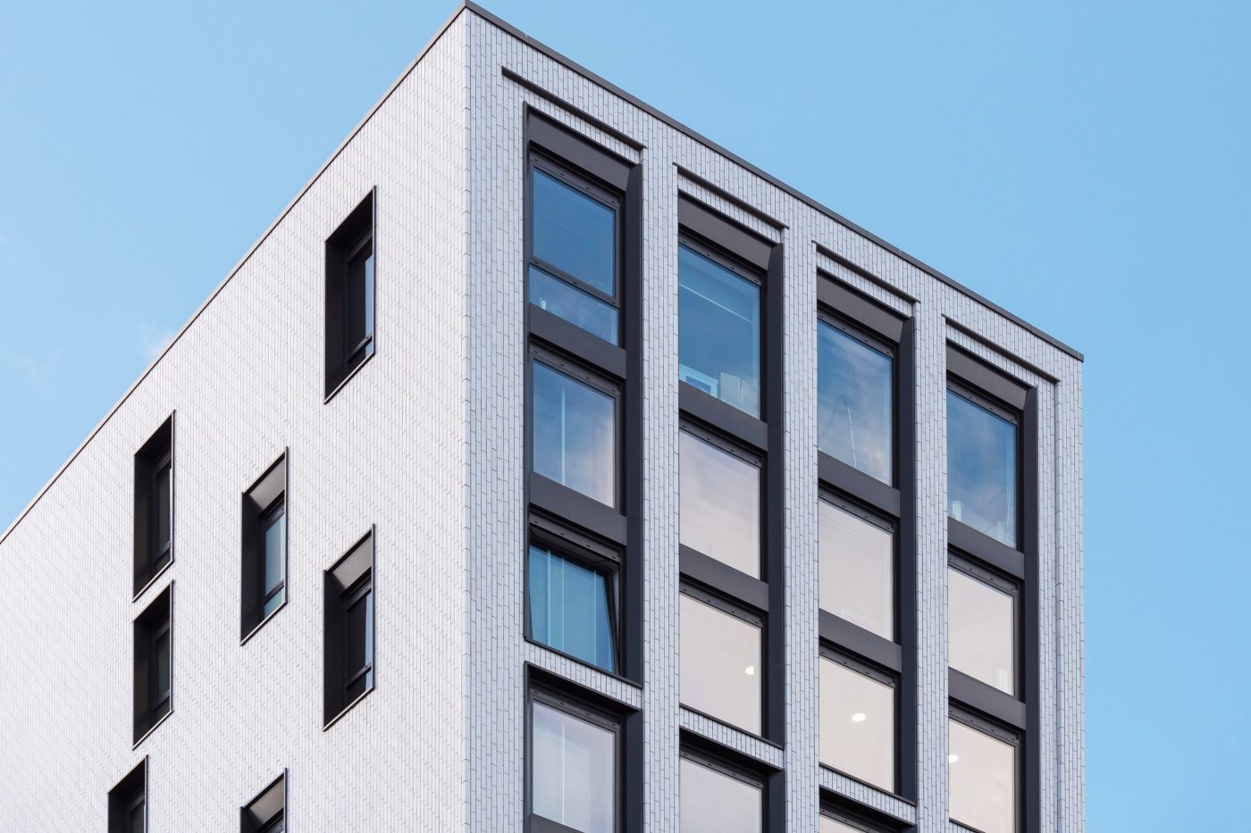 White Corium facade on modern multi-residential building