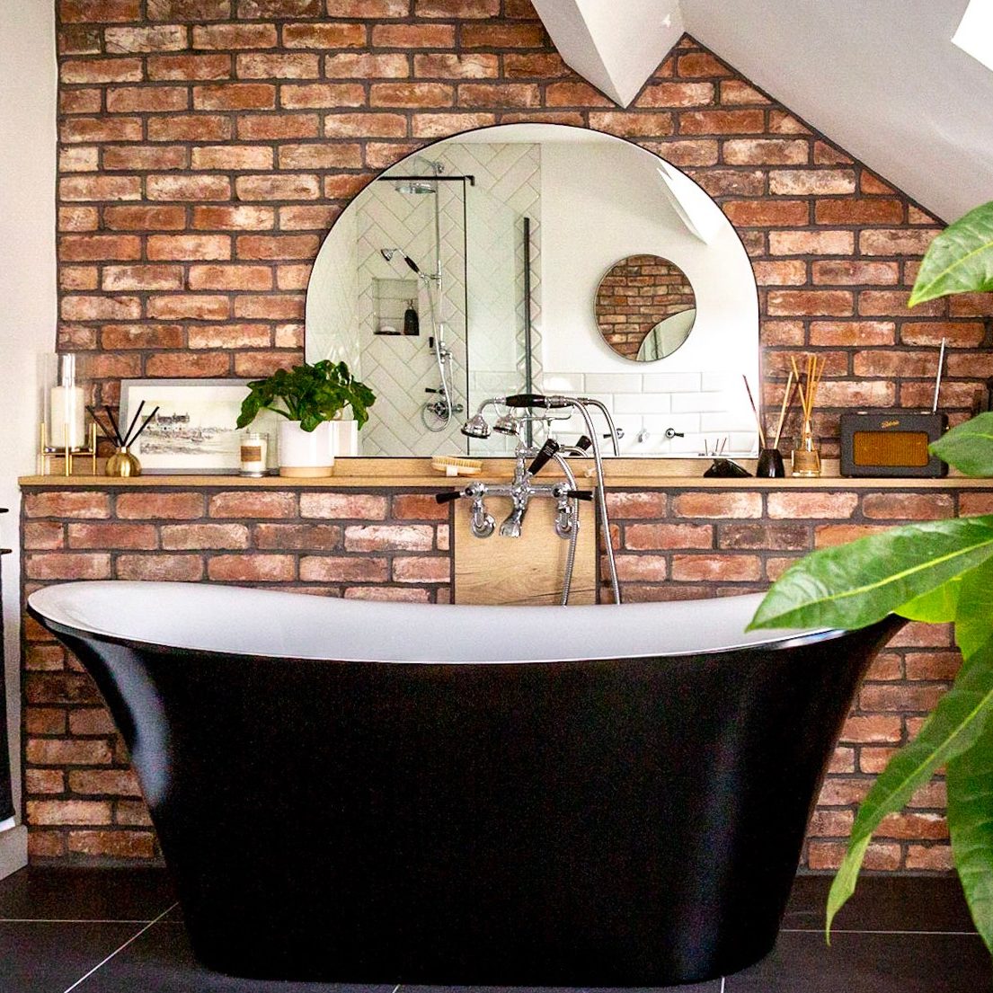 Modern bathroom with brick tile feature wall
