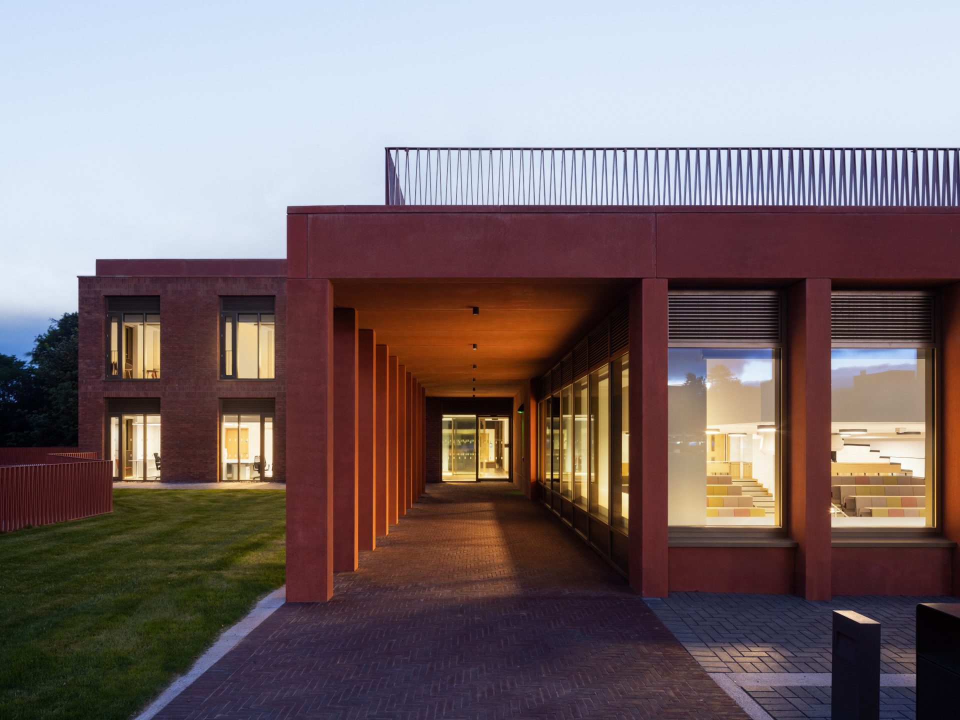Covered walkway of Riddel Hall building at dusk