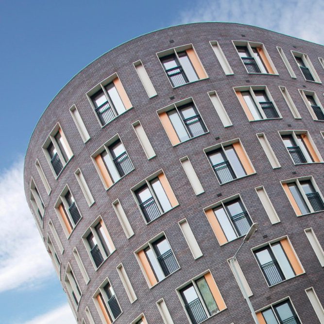 Curved exterior of modern apartment building