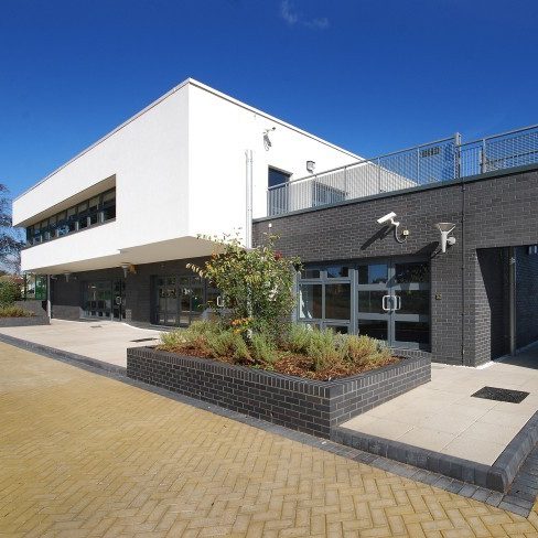 Modern style fire station with paved landscaping