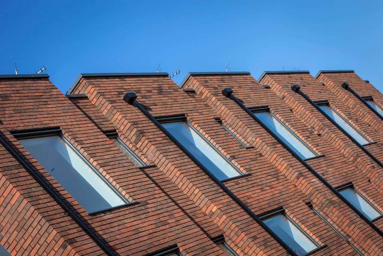 Covered walkway of Riddel Hall building at dusk